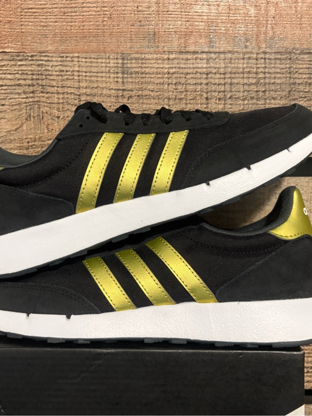 adidas black with gold stripes